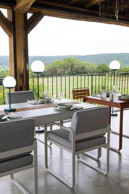Fermob Bellevie outdoor dining table in wood and metal, 196 x 90 cm, with storage, designed for eight-seater outdoor dining.