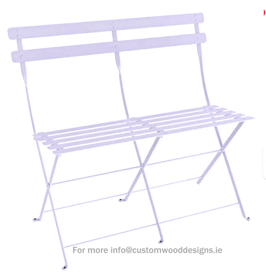 Fermob Marshmallow two-seater folding ottoman bench with a colorful, cushioned seat and metal frame, ideal for outdoor or indoor use.