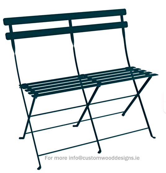 Fermob Acapulco two-seater folding ottoman bench in vibrant outdoor fabric, suitable for patio or garden seating.
