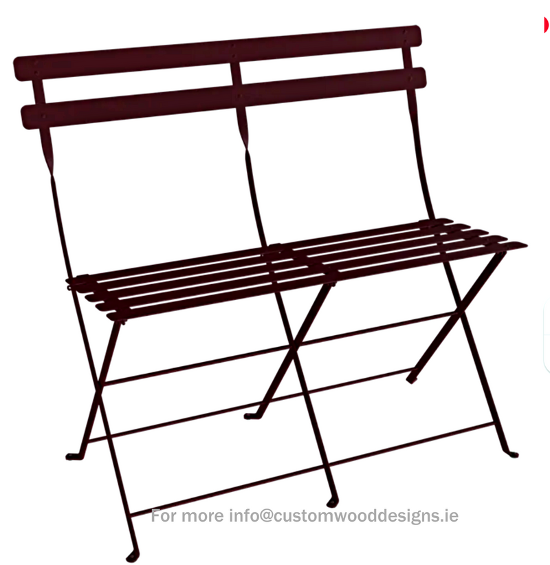 Load image into Gallery viewer, Fermob black cherry two-seater folding bench ottoman with wooden legs, versatile and stylish for indoor or outdoor use.
