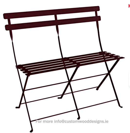 Fermob black cherry two-seater folding bench ottoman with wooden legs, versatile and stylish for indoor or outdoor use.