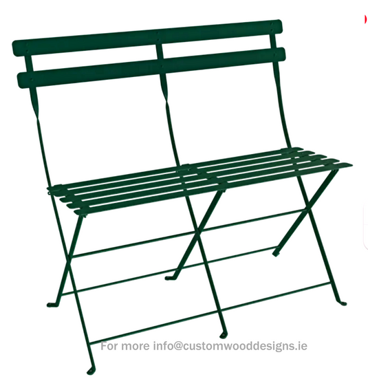 Cedar green Fermob Bistro two-seater folding ottoman bench with wooden legs and cushioned top for outdoor seating.