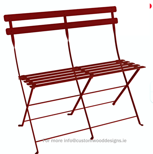 Fermob Bistro Two Seater Ottoman folding bench in vibrant chilli color, perfect for outdoor or indoor seating.