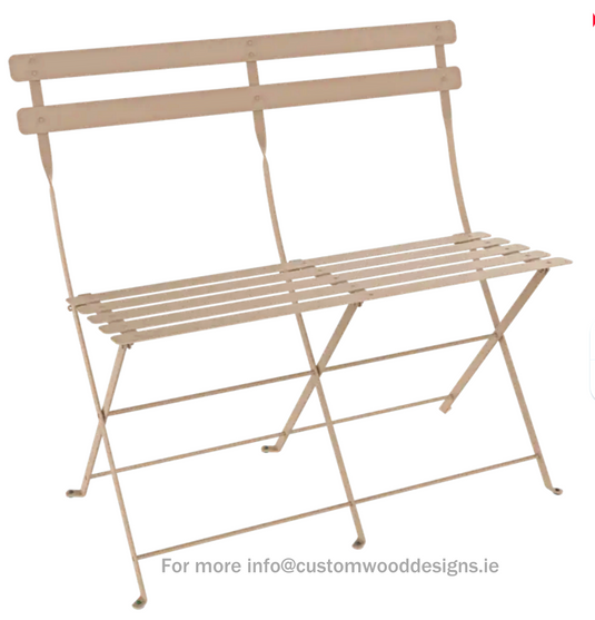 Fermob Bistro two-seater folding ottoman bench in nutmeg fabric, showcasing its compact, stylish design for outdoor or indoor use.