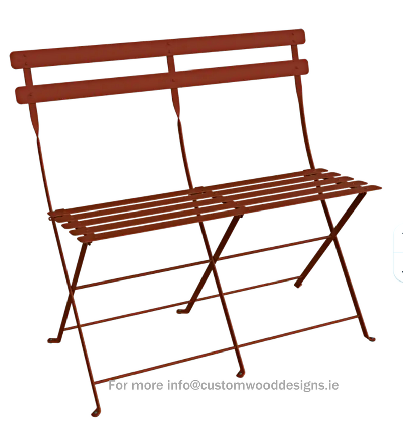 Load image into Gallery viewer, Red Fermob Bistro two-seater folding ottoman bench with wooden legs, featuring a vibrant ochre upholstery and modern design.
