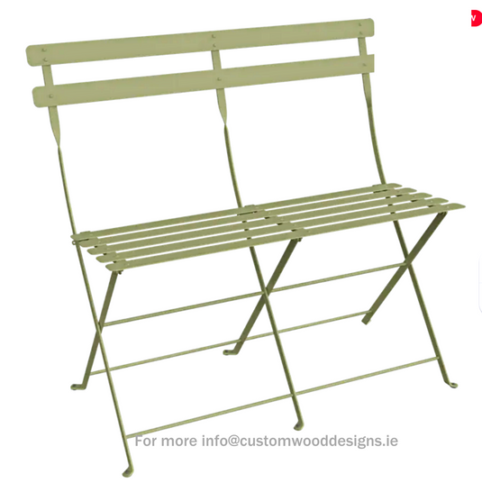 Willow green Fermob Bistro Two Seater Ottoman folding bench with wooden legs and cushioned seat, suitable for outdoor or indoor use.