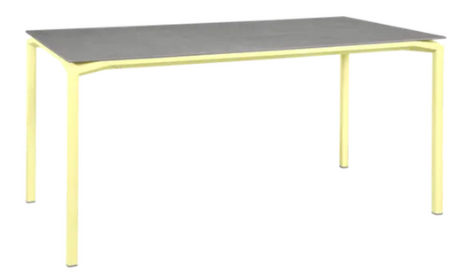 Fermob CALVI Creta mineral dining table in grey with lemon accents, 160 x 80 cm, six-seater outdoor table with modern design.