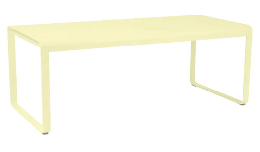 Fermob Bellevie outdoor metal dining table, 196x90 cm, eight-seater with frosted lemon finish, suitable for outdoor dining spaces.