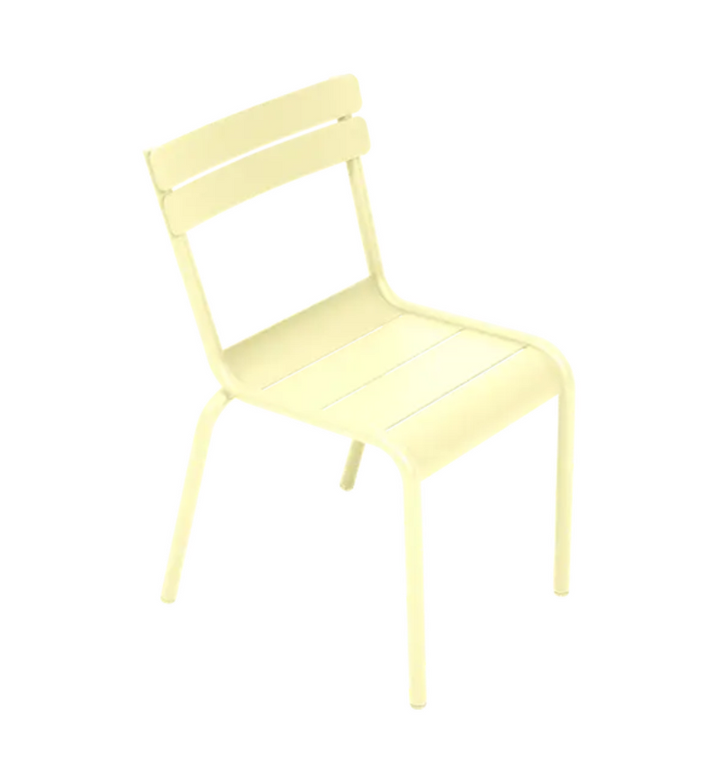Load image into Gallery viewer, Fermob Luxembourg Kid Chair in frosted lemon color, designed for children, featuring a modern, durable kids’ corner restaurant furniture style.
