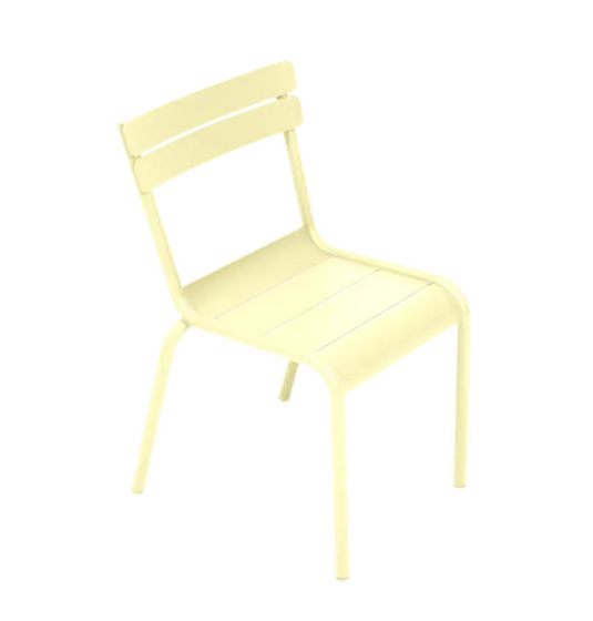 Fermob Luxembourg Kid Chair in frosted lemon color, designed for children, featuring a modern, durable kids’ corner restaurant furniture style.