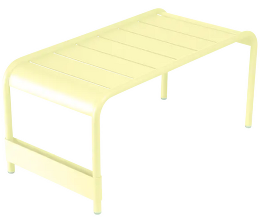 Fermob Luxembourg large low table or bench in frosted lemon color, measuring 86x44 centimeters, with a sleek modern design.