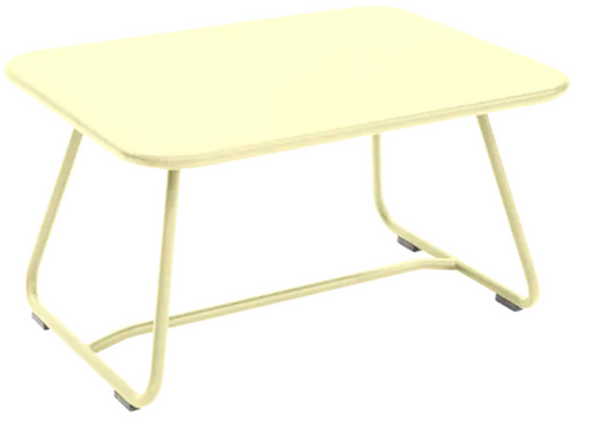 Fermob Sixties low outdoor table with frosted lemon finish, measuring 76x55.5cm, perfect for garden or patio seating areas.