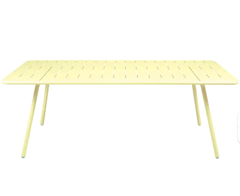 Load image into Gallery viewer, Fermob Luxembourg outdoor table, 210x100 cm, with frosted lemon finish, suitable for patio or garden seating.
