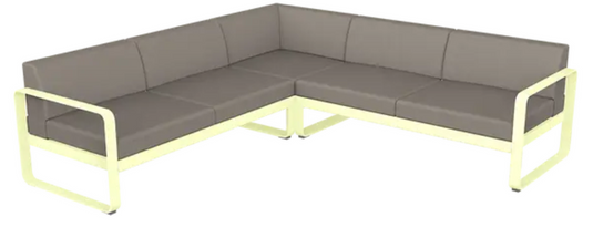 Fermob Bellevie Composition 2 outdoor sofa set with white, grey, and taupe cushions on a modern patio.