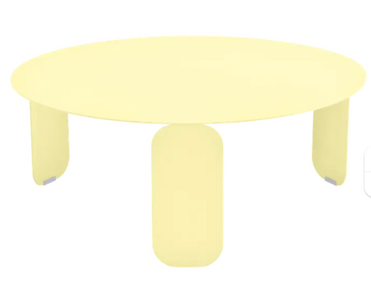 Fermob Bebop Low Outdoor Table with 80cm diameter, frosted lemon color, anthracite finish, round design for patio or garden.