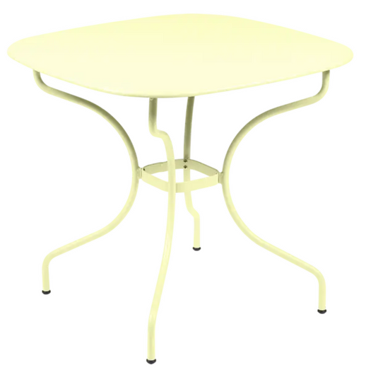 Fermob OPÉRA+ Carronde outdoor metal table with frosted lemon finish, 82x82 cm, suitable for garden or patio use.