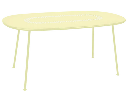 Fermob LORETTE oval metal outdoor dining table, 160x90 cm, with frosted lemon finish, suitable for patio or garden dining.