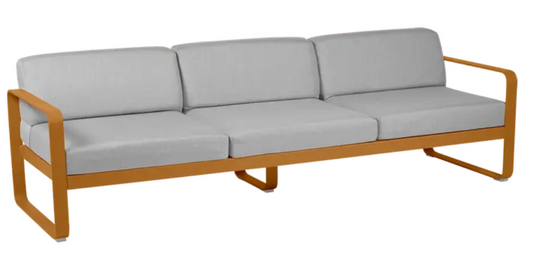 Fermob Bellevie 3-seater outdoor sofa with metal frame, featuring grey fabric cushions and a modern outdoor furniture design.