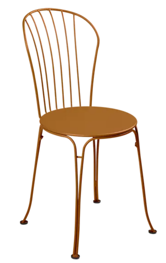 Fermob OPÉRA+ outdoor metal chair in gingerbread color, stylish seating for patio or restaurant outdoor dining.