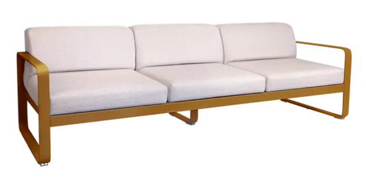 Fermob Bellevie 3-seater outdoor sofa with metal frame and gingerbread pearl cushions, ideal for garden or patio relaxation.