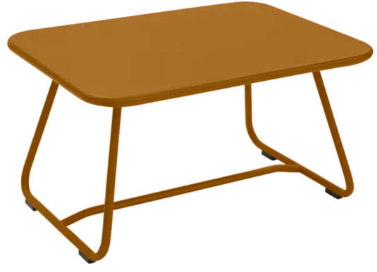 Fermob Sixties low outdoor table in gingerbread color, 76 x 55.5cm, with a sleek modern design for patio or garden use.