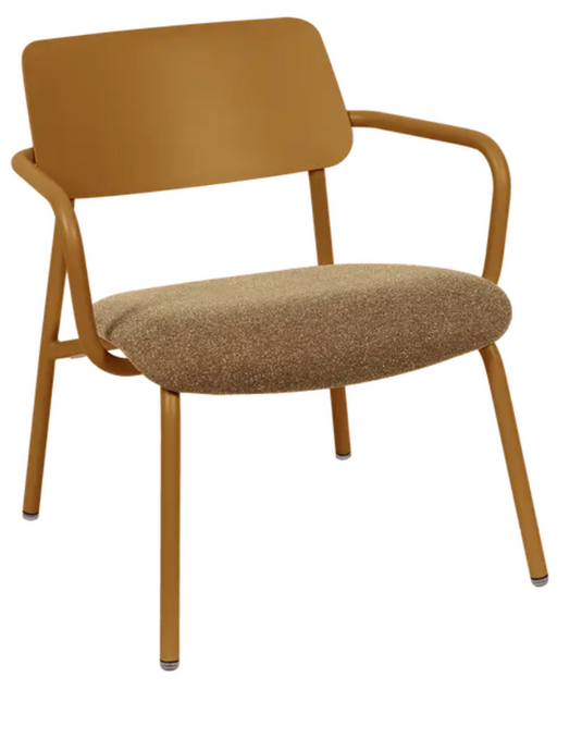 Fermob Studie fabric lounge armchair with metal frame, featuring a gingerbread-colored upholstery and wide, comfortable seating.