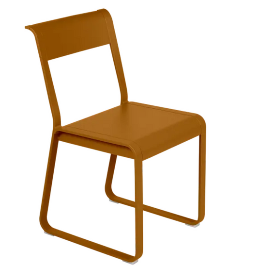 Fermob Bellevie Chair V2, a stylish gingerbread-colored metal outdoor chair with a modern design and curved backrest.