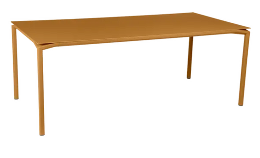 Fermob Calvi rectangular outdoor dining table, 195x95 cm, eight seater, with wooden top and metal legs, suitable for outdoor and indoor use.
