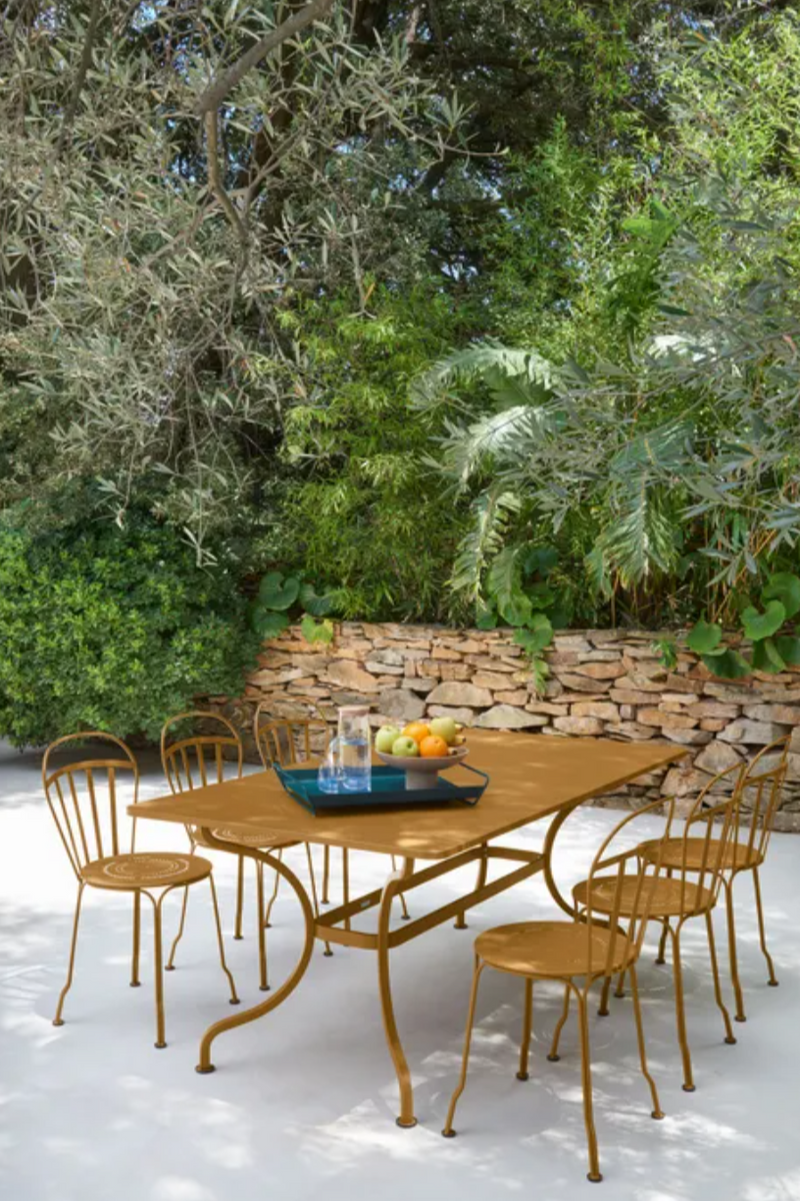 Load image into Gallery viewer, Fermob Romane table in gingerbread color, 180x100 cm, outdoor dining table for up to 8 guests, with a sleek metal design.
