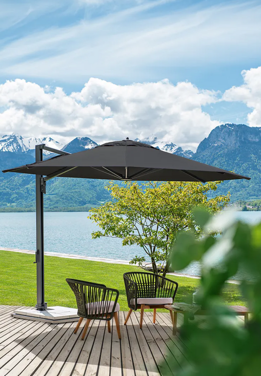 Outdoor GORDES Low Armchair by Custom Wood Designs with teak frame and rope details, ideal for outdoor lounging.