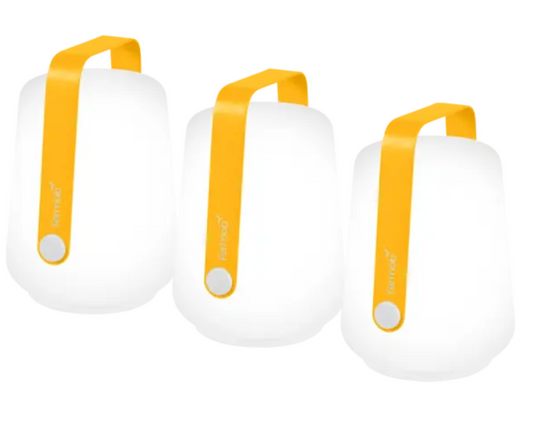 Set of 3 Fermob HoneyBallad mini outdoor lamps, 12 cm tall, featuring small spherical design for outdoor lighting.