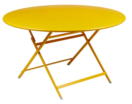 Fermob Caractère foldable metal table with a 128cm diameter, showing its honey-colored finish and eight-seater design.