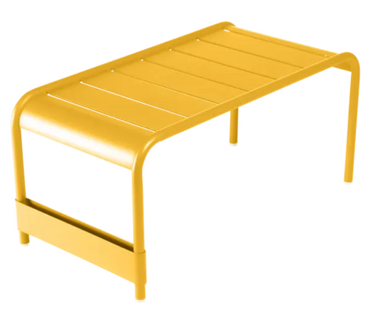 Fermob Luxembourg large low table and bench in honey finish, measuring 86x44 cm, with a sleek modern design and smooth surface.