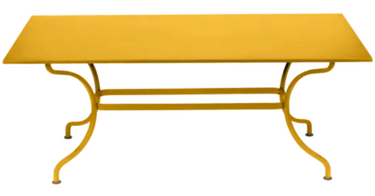 Fermob Romane table in honey finish, 180x100 cm, designed for up to 8 guests, outdoor dining table with stylish metal design.