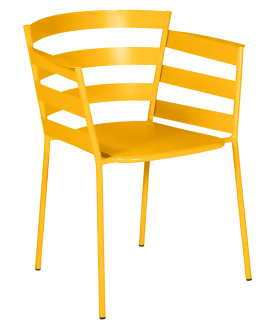 Honey-colored Fermob RYTHMIC outdoor armchair with a woven design, perfect for garden or patio seating.
