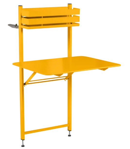 Fermob Bistro balcony table, foldable metal outdoor furniture for apartments and hotel rooms, honey-colored finish.