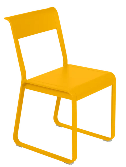 Honey-colored Fermob Bellevie V2 metal chair with a sleek, modern outdoor design and curved armrests.