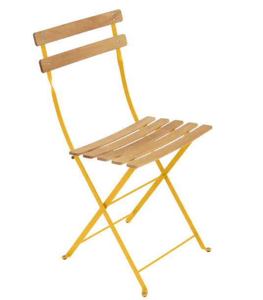 Fermob Bistro Natural folding chair with wood seat and metal frame, ideal for outdoor dining and patio furniture.