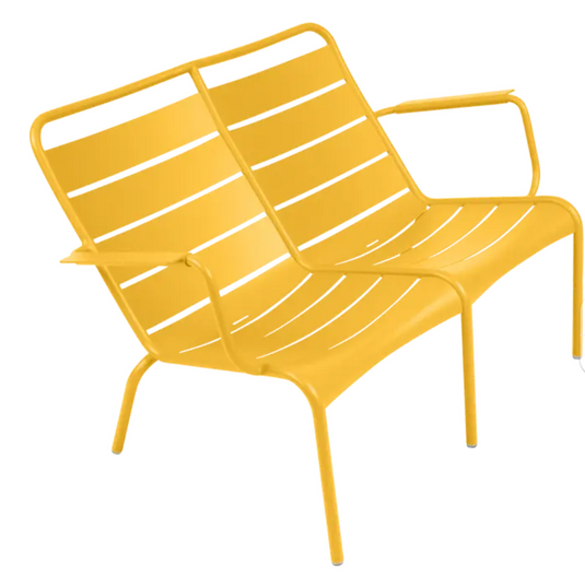 Honey-colored Fermob Luxembourg Duo Low Armchair, a stylish Fermb Kids Corner Contract Bench with a modern design.