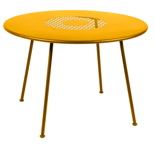 Fermob LORETTE round garden table with 110cm diameter, honey-colored metal surface, fire-resistant outdoor furniture.