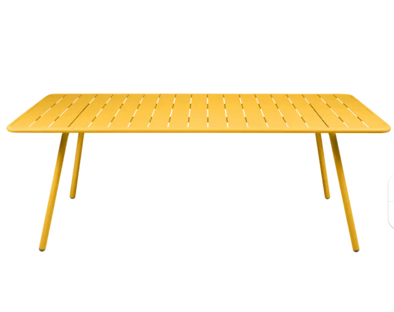 Load image into Gallery viewer, Honey Fermob Luxembourg outdoor table, 207x100 cm, weather-resistant table for outdoor dining and patio use.

