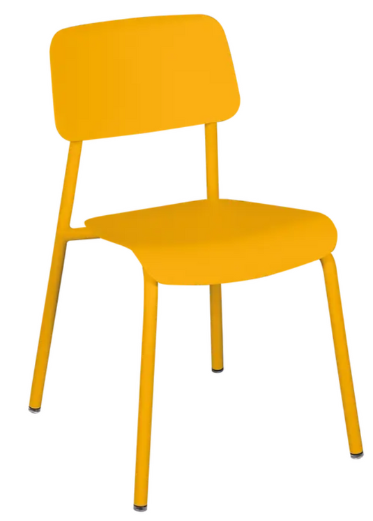 Fermob Honey Studie outdoor chair with a modern design, featuring a sleek metal frame and a comfortable honey-colored seat.