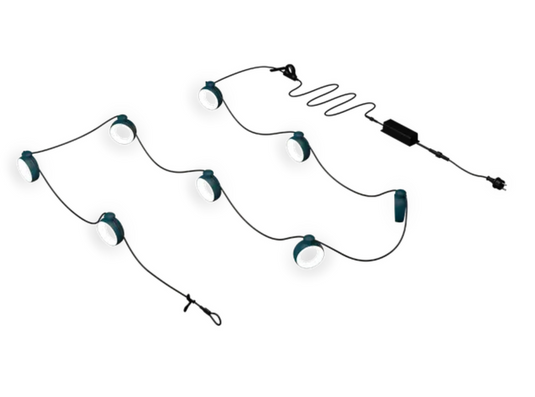 Fermob HOOPIK string lights, 1200 cm outdoor lighting for restaurants and hotels, featuring warm glowing bulbs and black cord.
