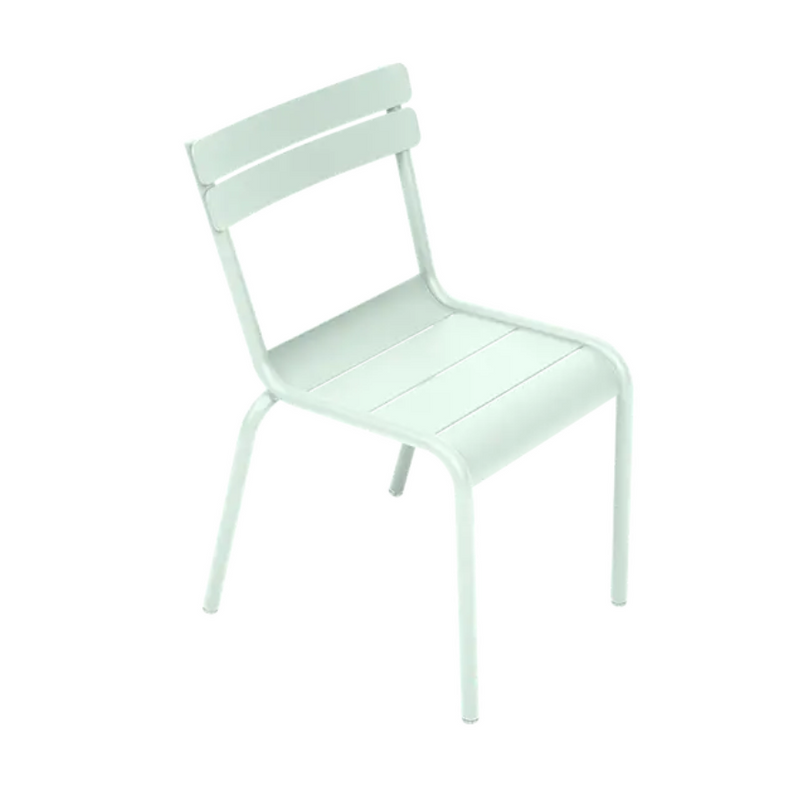 Load image into Gallery viewer, Fermob Luxembourg Kid Chair in Ice Mint color, child-sized restaurant chair with sleek design for kids' corner or furniture setting.
