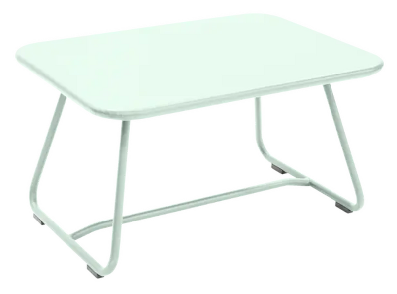 Load image into Gallery viewer, Ice Mint Fermob Sixties low outdoor table, 76x55.5cm, showcasing its sleek design and vibrant color for outdoor use.
