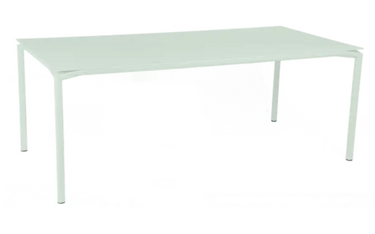 Fermob Calvi outdoor rectangular dining table in ice mint, 195 x 95 cm, suitable for eight seats, featuring modern design.