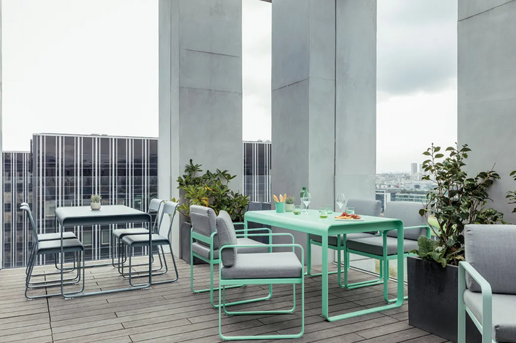 Fermob Bellevie Chair V2, a sleek outdoor metal chair with a modern design, shown in a stylish outdoor setting.