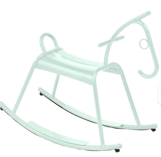 White ADADA rocking horse by Fermob, designed for kids' restaurant waiting areas, made of durable kids' corner furniture material.