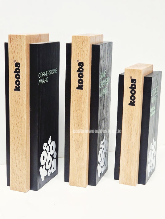 Custom Made Awards by Custom Wood Designs featuring elegant wooden award plaques with engraved details.