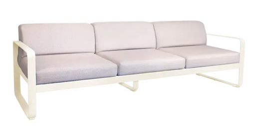 Latte beige Fermob Bellevie 3-seater outdoor metal sofa with a sturdy frame and comfortable cushions, ideal for patio relaxation.